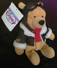 Disney Store Winnie the Pooh Pilot plush toy, featuring the character in a...
