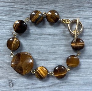 Authentic Tiger's eye bracelet with gold plated toggle clasp, roughly 7 1/2 inches