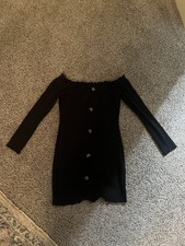Short black long sleeved bodycon sress with buttons