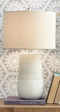 Signature Design by Ashley Shavon Ceramic Table Lamp in Beige and White