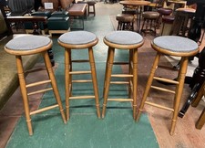 Set of 4 pub bar stools with light wood frames