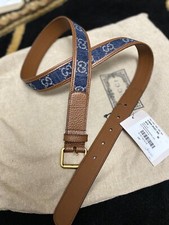 GUCCI Grained calfskin belt in brown featuring logo-woven denim trim in blue 90