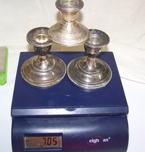 Three Sterling Weighted Candle Sticks