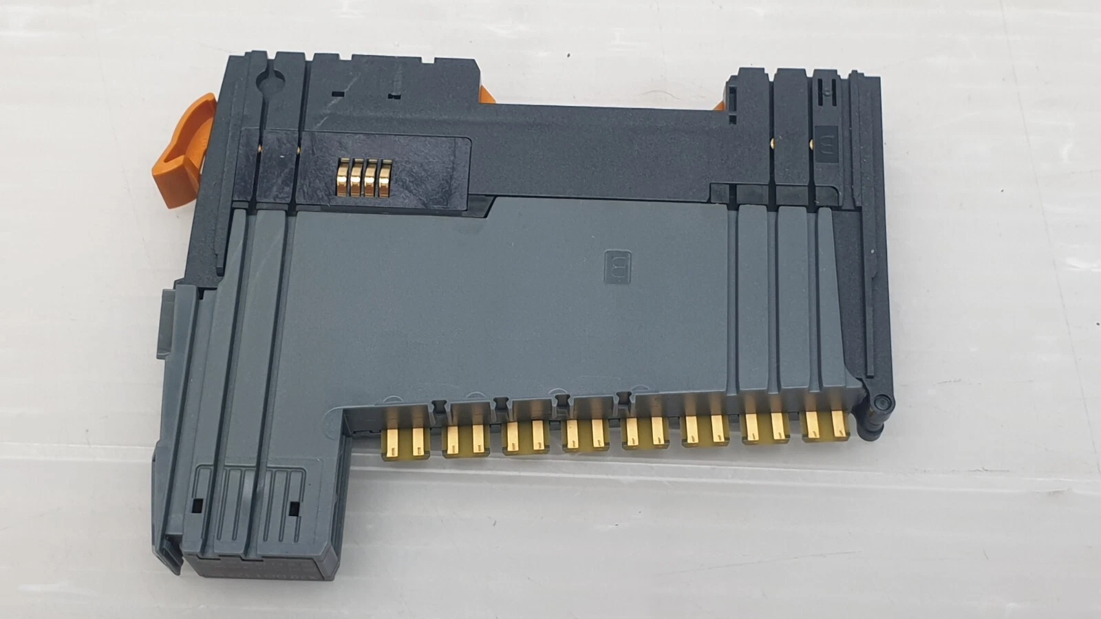 Back of the X20 DO F322 module with gold terminal block contacts