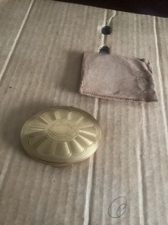 A Vintage Powder Compact By KGIU oval decorated gold finish