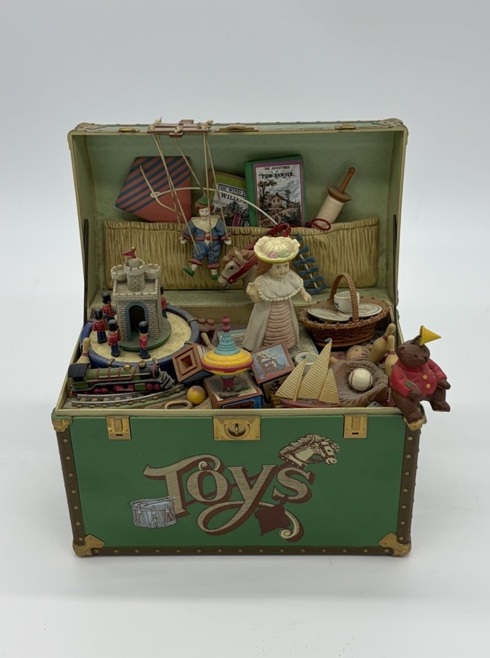 A tested 1986 Enesco treasure chest that pops open to a toy symphony — the kind of whimsical nostalgia piece that stops people mid-conversation.