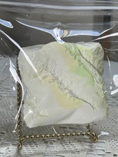 Taba Squishy large cake, yellow, & green accents. Has  liquid texture- Fidget