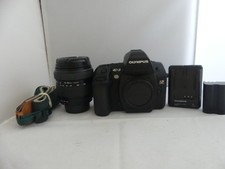 Olympus EVOLT E-3 10.1MP with Olympus 18-180mm zoom lens Shutter count is '328'.