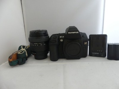 Olympus EVOLT E-3 10.1MP with Olympus 18-180mm zoom lens Shutter count is '328'.