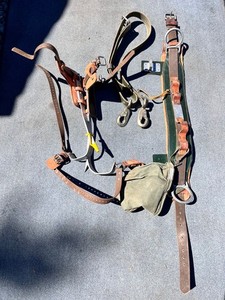 Lineman climbing Buhrke Belt & Buckingham Hooks - tool bag & safety strap