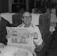 Jerry Barber captain of American Ryder Cup team reading a newspap- 1961 Photo