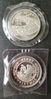 Two 1990 Christmas 1oz Silver Rounds in Plastics