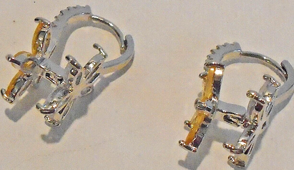 Pendientes. Montura plateada con flor de cristal amarillo. Fila transparente de cristales en paca. Foto 2 de 3