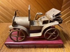 Antique Folk Art Handmade 6.5" Metal Model Car / Red Vinyl Stand