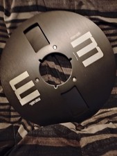 Maxell Black metal reel, 10.5 in x 1/4 inch, with setup box.