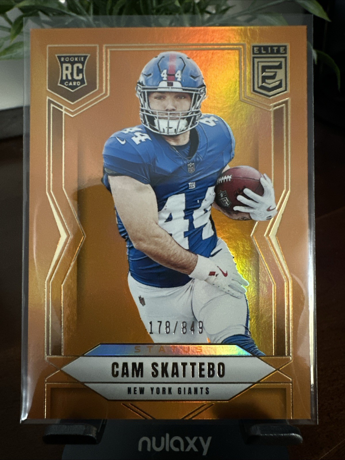 2025 Panini Donruss Elite - Cam Skattebo #153 Status Metallic Orange /849 (RC)