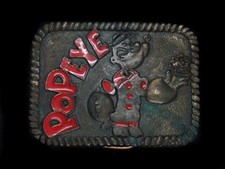 TI11161 VINTAGE 1980 POPEYE W/ SPINACH CARTOON BELT BUCKLE
