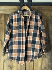 Billabong flannel shirt in a brown and black plaid pattern.  Women’s Size L