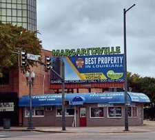 busy corner, not so much traffic competing signs that draw historic photo