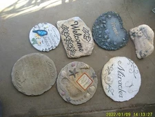 ASSORTMENT OF USED RESIN STEPPING STONES VERSES PLUS STONE SEASONAL