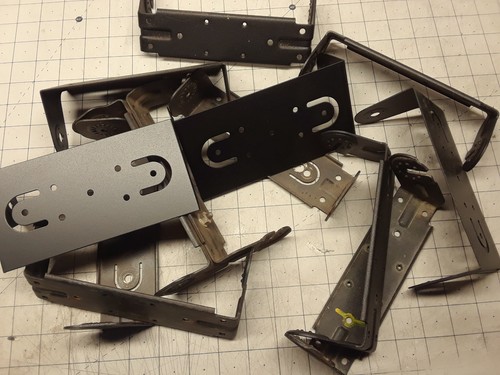 LOOKING AT A LOT OF 13 MOTOROLA AND ASSORTED RADIO BRACKETS