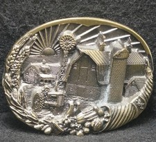 XA11143 NOS VINTAGE 1982  FARMLAND  BARN, SILO, TRACTOR ARTWORK BELT BUCKLE