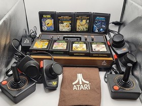 Atari 2600 System Bundle with Console ,8 Games, Joysticks, Paddles, & Dust Cover