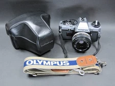 Olympus OM10 Silver 35mm SLR Film Camera w/ 50mm F1.8 Lens [Near Mint]