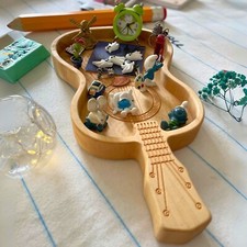 Guitar shaped serving tray made up of wood