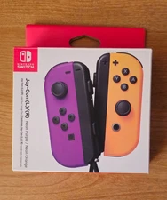 Nintendo Switch / OLED Official Nintendo Joycon Neon Orange &  Neon Purple Used