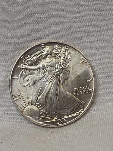 KEY DATE- 1986- AMERICAN SILVER EAGLE- .999 FINE SILVER - NR AUCTION- T0165