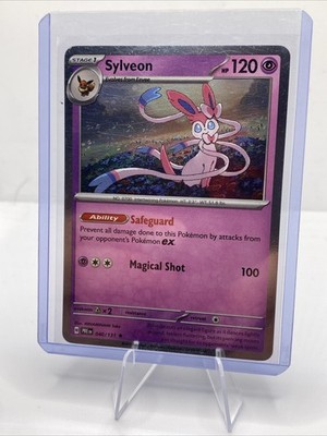 Pokemon - Prismatic Evolutions Cosmos Holo Sylveon 040/131 NM