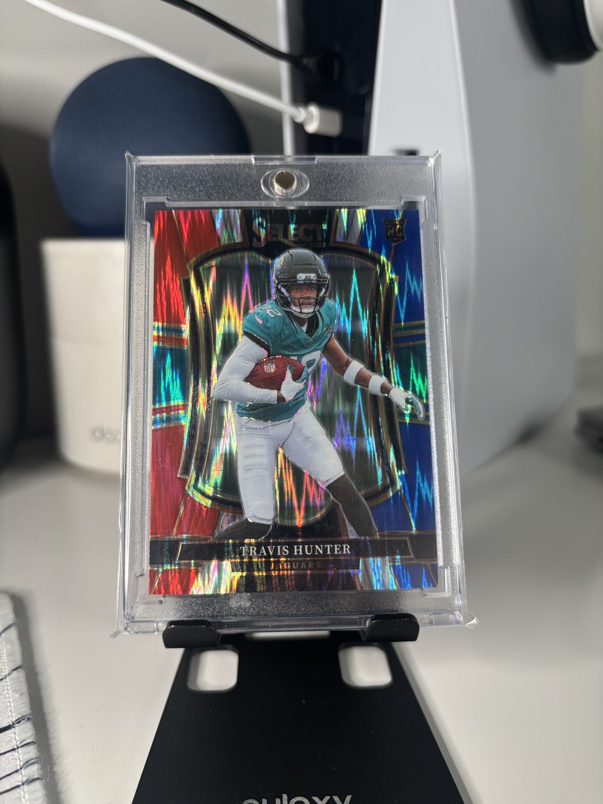 2025 Panini Select #128 Travis Hunter Red and Blue Prizm Shock (RC)