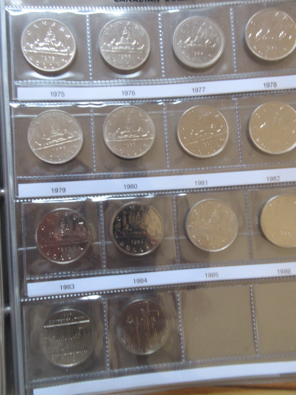 Set of Canada Nickel Dollars Coins Brown UNI-SAFE Album 1968-1986. UNC Coins