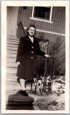Vtg Snapshot Smiling Woman in Long Winter Coat On Brick Building Steps 1940s