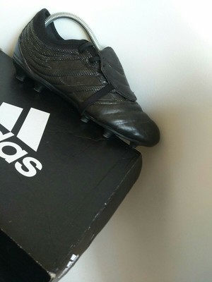 triple black football boots