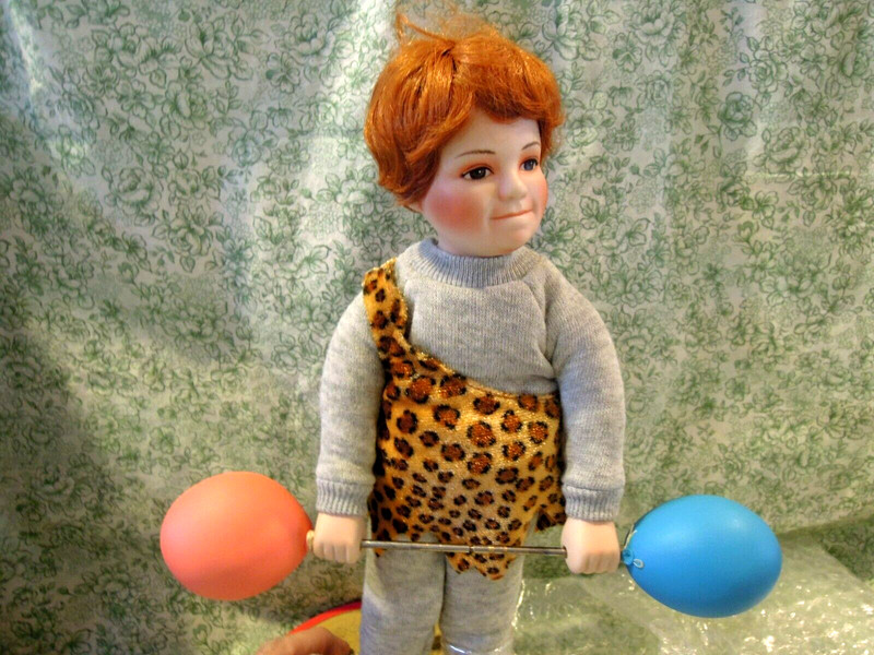 Hd-722 "JOHNNY the STRONGMAN" Porcelain/cloth boy doll 10" tall w/stand; Knowles