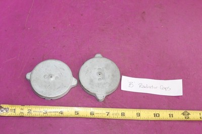Two (2) Vintage Radiator Caps marked  B .