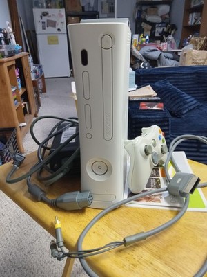 Microsoft Xbox 360 Arcade White Console with controller and external hard drive.