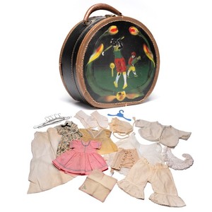 Vintage round doll suitcase filled with vintage doll clothes 1920s