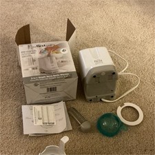 The First Years 2-in-1 Simple Serve Baby Bottle Warmer with Accessories  Box