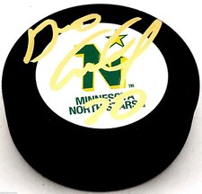 DINO CICCARELLI SIGNED VINTAGE NORTH STARS HOCKEY PUCK HOFer  000038