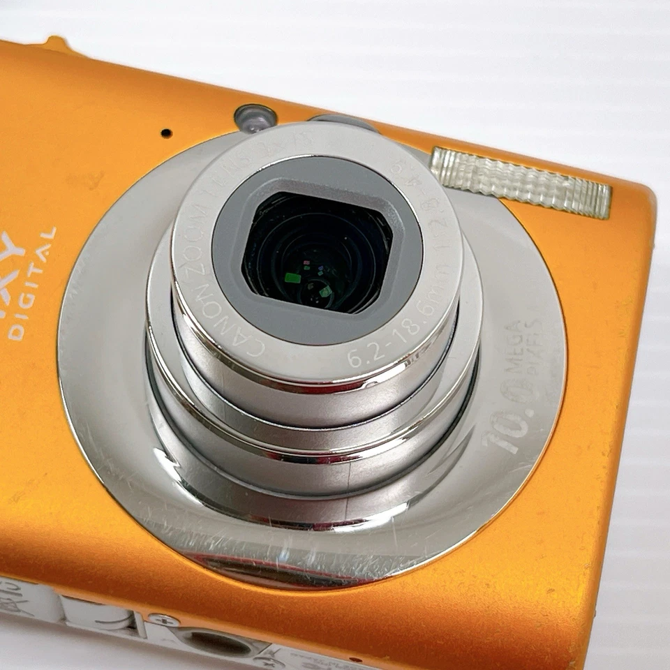 Restaurada Excelente+ Cámara Compacta Canon IXY Digital 110 IS Naranja Probada Foto 3 de 4