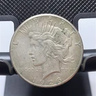 1928p PEACE SILVER DOLLAR, 360,649 Minted. Coin Appears To Be In XF Condition.