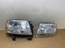 1999 - 2004 Jeep Grand Cherokee Leftright Set Black Halogen Headlights W5217 Dw 1999 - 2004 Jeep Grand Cherokee Leftright Set Black Halogen Headlights W5217 Dw