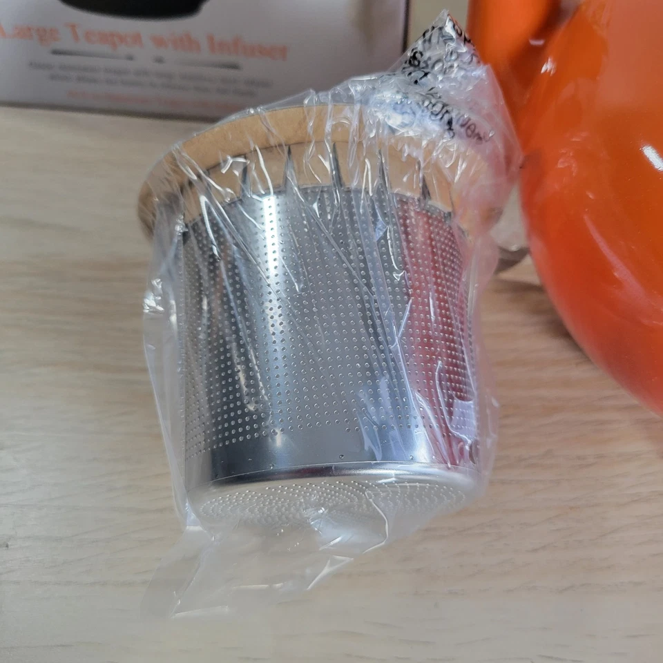 Tetera pequeña de gres Le Creuset con infusor rojo volcánico naranja nueva caja abierta Foto 3 de 4