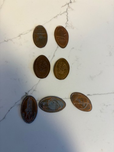 Set of 7 flat pressed commemorative pennies