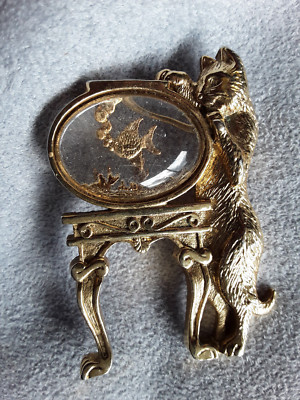 Amusing large pin of a cat looking into a fishbowl fine detail bright and clear