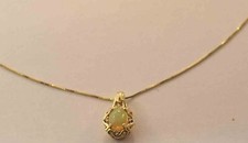 10K YELLOW GOLD - OPAL (.75Ct) DIAMOND (.12Ct...