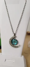 Crescent Moon, tree of life pendant necklace with a blue glass